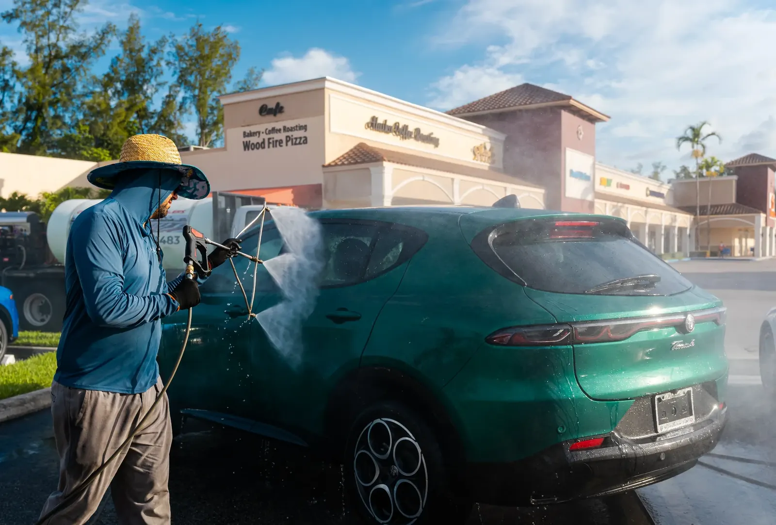 Spotless rinse on green SUV at South Florida lot